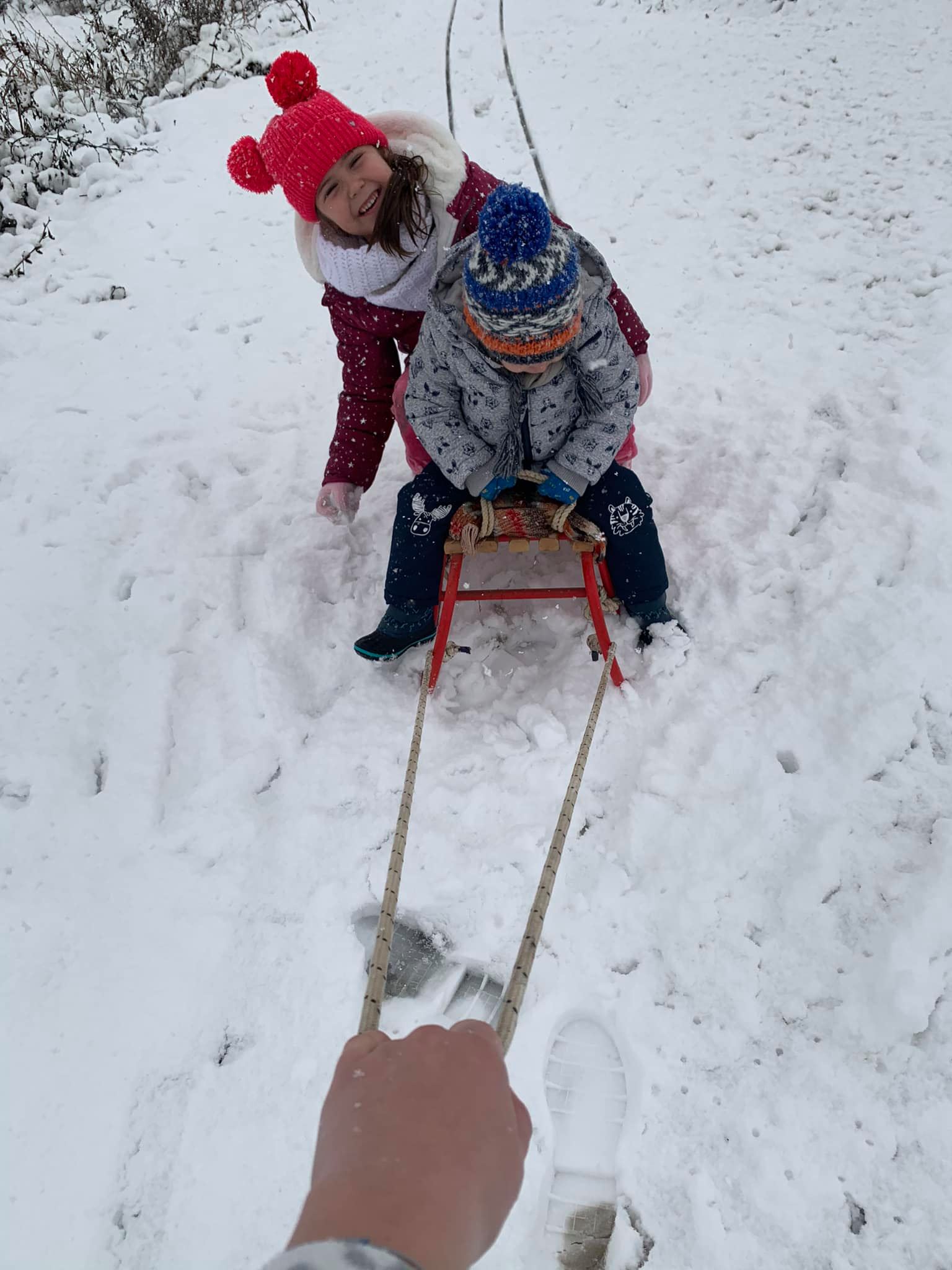 May be an image of child, outerwear and snow